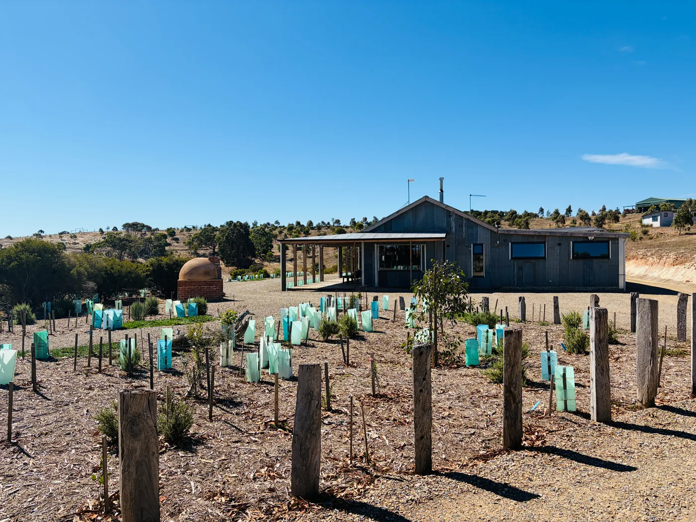 The Forktree Project's restored shearing shed with pizza oven and native plantings