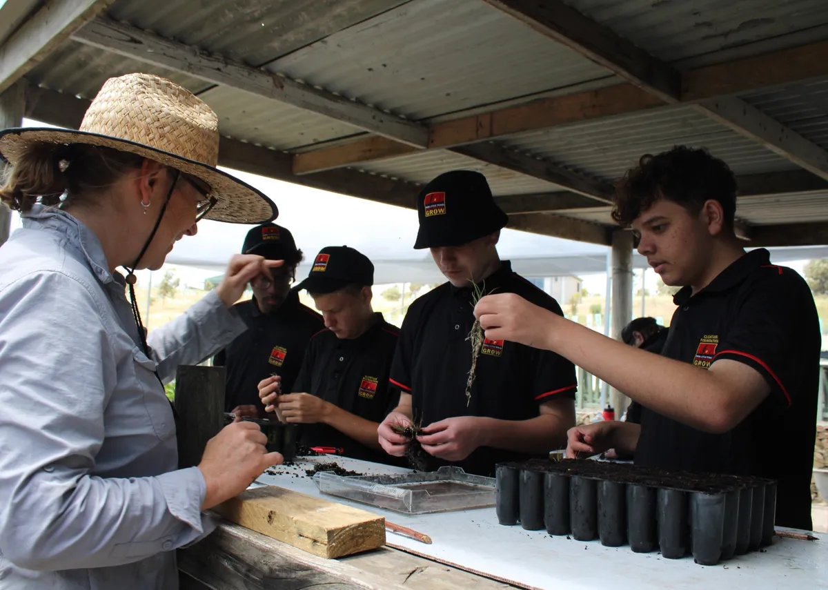Students potting native seedlings in The Forktree Project nursery